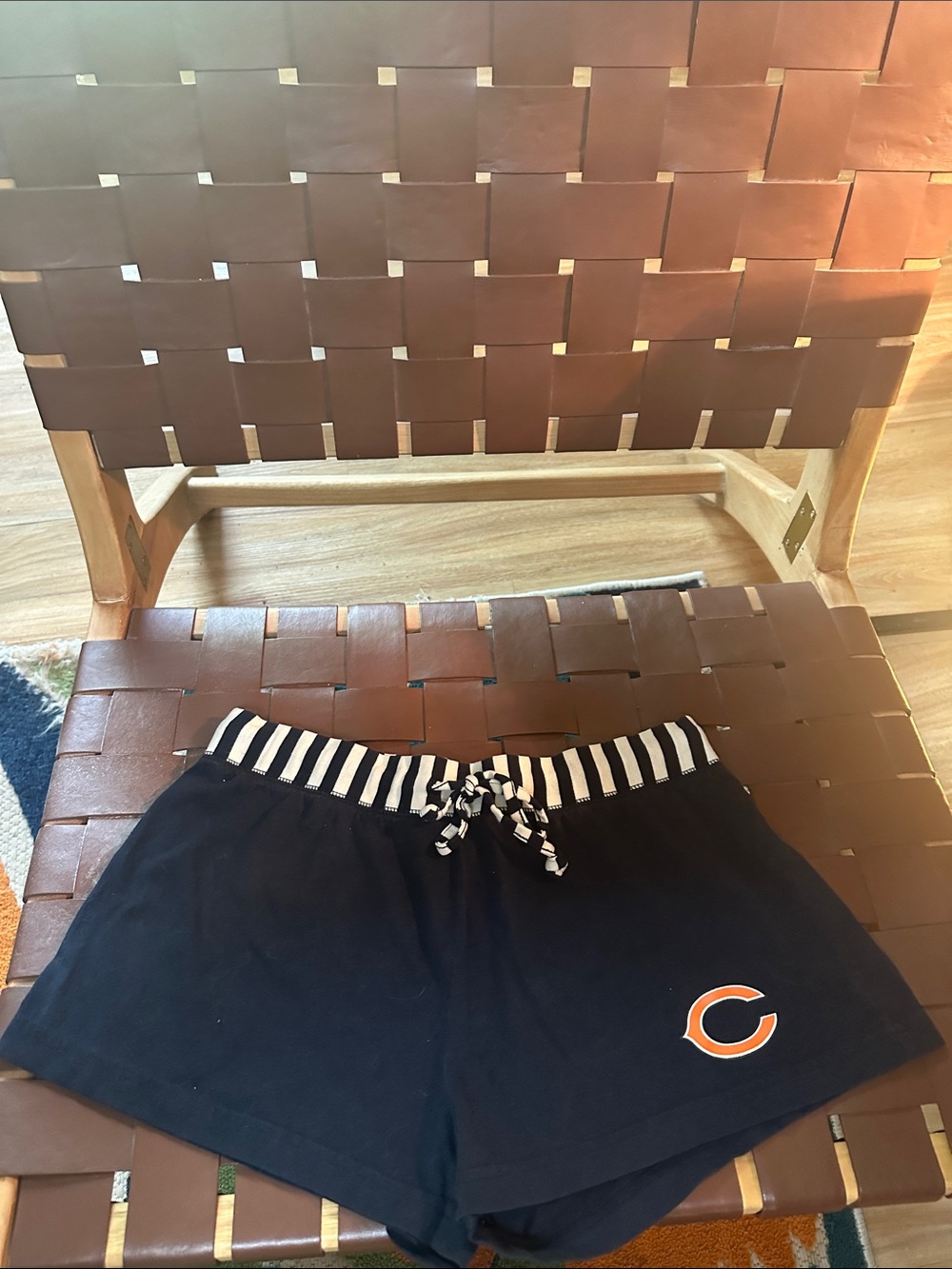 NFL Women's navy Athletic Shorts with Striped Waistband and Orange Logo